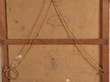 painting hanging on the wall of a room with a wooden frame and rope