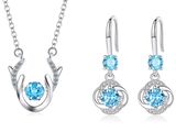 une parure de bijoux composée de topazes bleues et de topazes blanches