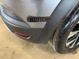 a close up of a car with a sticker on it ' s bumper