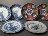 six blue and white plates with oriental designs on them on a table