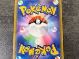 a close up of a pokemon card on a table