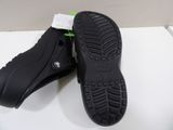 a close up of a pair of black shoes on a white surface