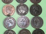 a lot of coins that are on a green surface