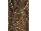 a gold vase with a bird on it on a white background