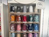 many spools of thread on display in a store
