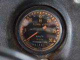 a close up of a speedometer on the dashboard of a car