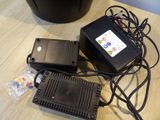two electronic devices sitting on a table next to each other