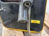 an image of a close up of a machine on a wooden pallet