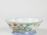a close up of a bowl on a table with a white background