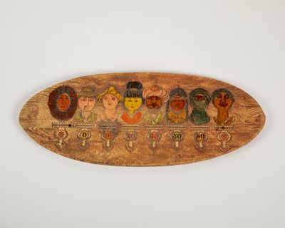 a wooden plaque with a group of people painted on it
