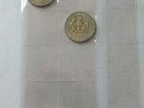 five different types of coins in a clear bag
