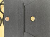 an image of a close up of a jacket with a tie on it