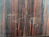 a close up of a wooden door with peeling paint on it