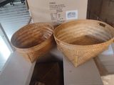 two baskets that are sitting on top of a counter