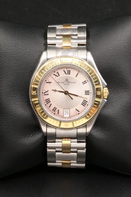 rolex lady ' s watch with two tone gold bezel and roman numerals