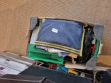 a pile of luggage sitting on the ground next to a wall
