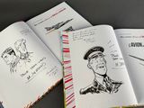 two open books with drawings of a man and a woman on them
