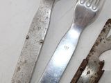 a knife, fork, and spoon sitting on a table