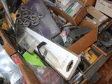 a box full of assorted items in a cluttered room