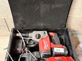 a tool box with tools in it sitting on the floor