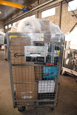 a large metal cage with a bunch of boxes in it