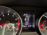 a close up of a car dashboard with a speedometer and gauges