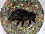 a plate with a picture of a boar on it