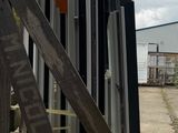 a ladder that is sitting next to a pile of pipes