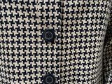 a close up of a black and white jacket on a mannequin mannequin mannequin mannequin mannequin mannequin mannequin