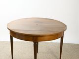 an image of a round table with a wooden top