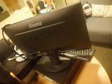 an image of a computer monitor and keyboard on a table