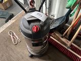 a picture of a duster and broom in a garage