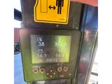 a close up of a parking meter with an arrow pointing to the left