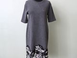 a gray dress with black and white flowers on it