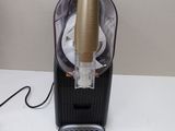 a black and gold blender on a white counter
