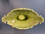 an image of a green bowl sitting on top of a table