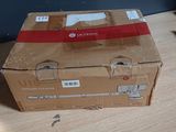 a box that is sitting on a table next to a keyboard