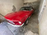 a red car that is parked in a garage