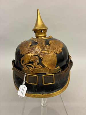 an old helmet with a golden eagle on it