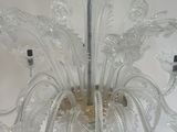 a chandelier made of glass hanging from the ceiling