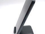 a close up of a cell phone on a stand