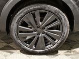 a close up of a car tire on the ground