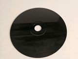 a picture of a cd disc on a white surface