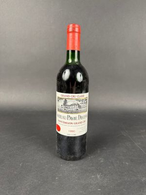a bottle of red wine sitting on top of a table