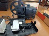 a cell phone sitting on a table next to a camera and a projector