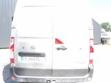 a white van that is parked in a parking lot