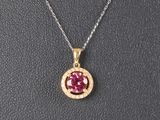 un pendentif en tourmaline rose et diamants, monté sur une chaîne en argent