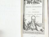 someone is holding a book with a picture of a bird on it