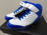 a close up of a pair of blue and white shoes on a box