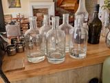 a counter with a lot of bottles and glasses on it